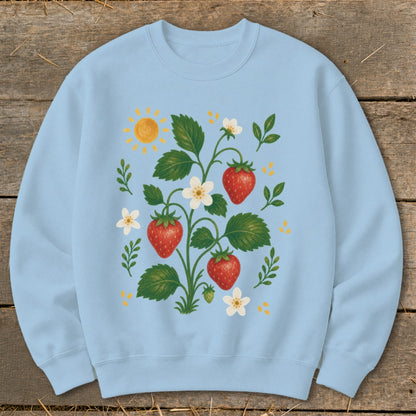 Light blue sweatshirt with a colorful strawberry plant illustration and a sun.