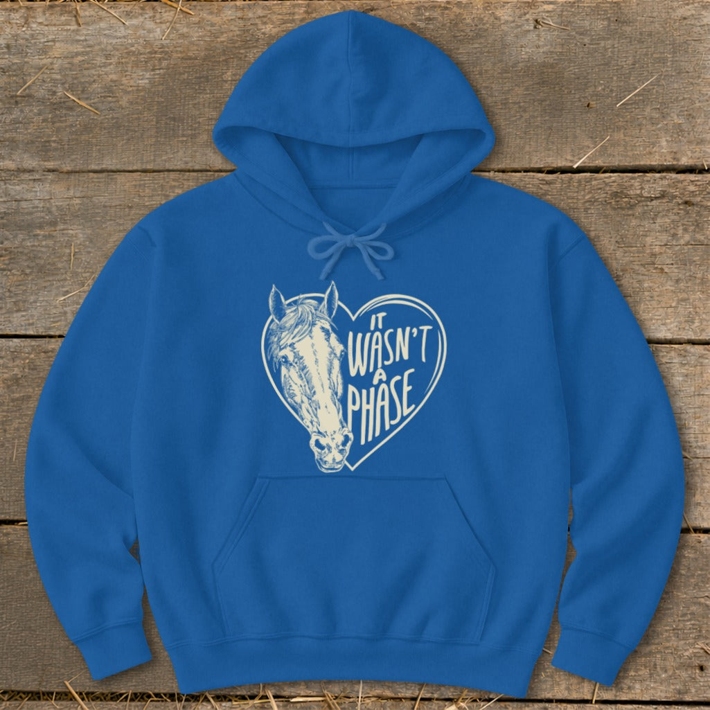 Blue hoodie with a horse head inside a heart that says "It Wasn't a Phase".