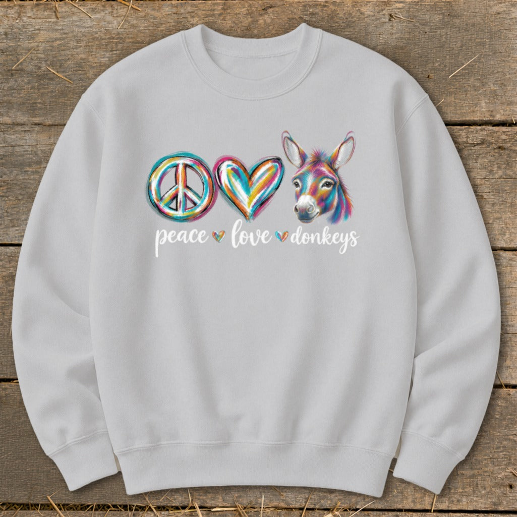 Peace, love, and donkeys graphic on a light gray sweatshirt with colorful watercolor details.