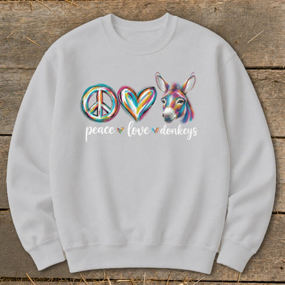 Peace, love, and donkeys graphic on a light gray sweatshirt with colorful watercolor details.