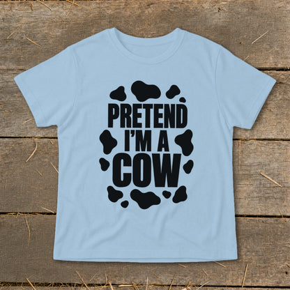 Light blue t-shirt with "PRETEND I'M A COW" and cow spots design.
