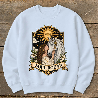 Woman kissing white horse under sun with "Soul Bound" text.