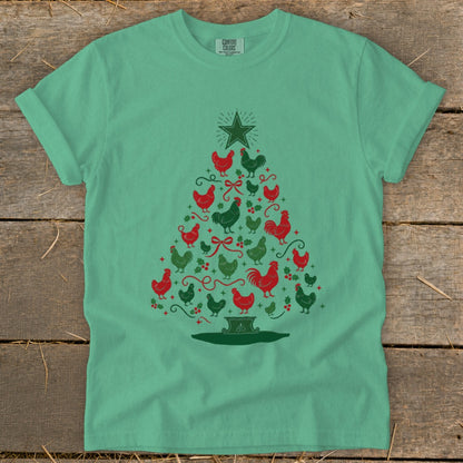 Green t-shirt with a Christmas tree made of red and green chickens and festive accents.