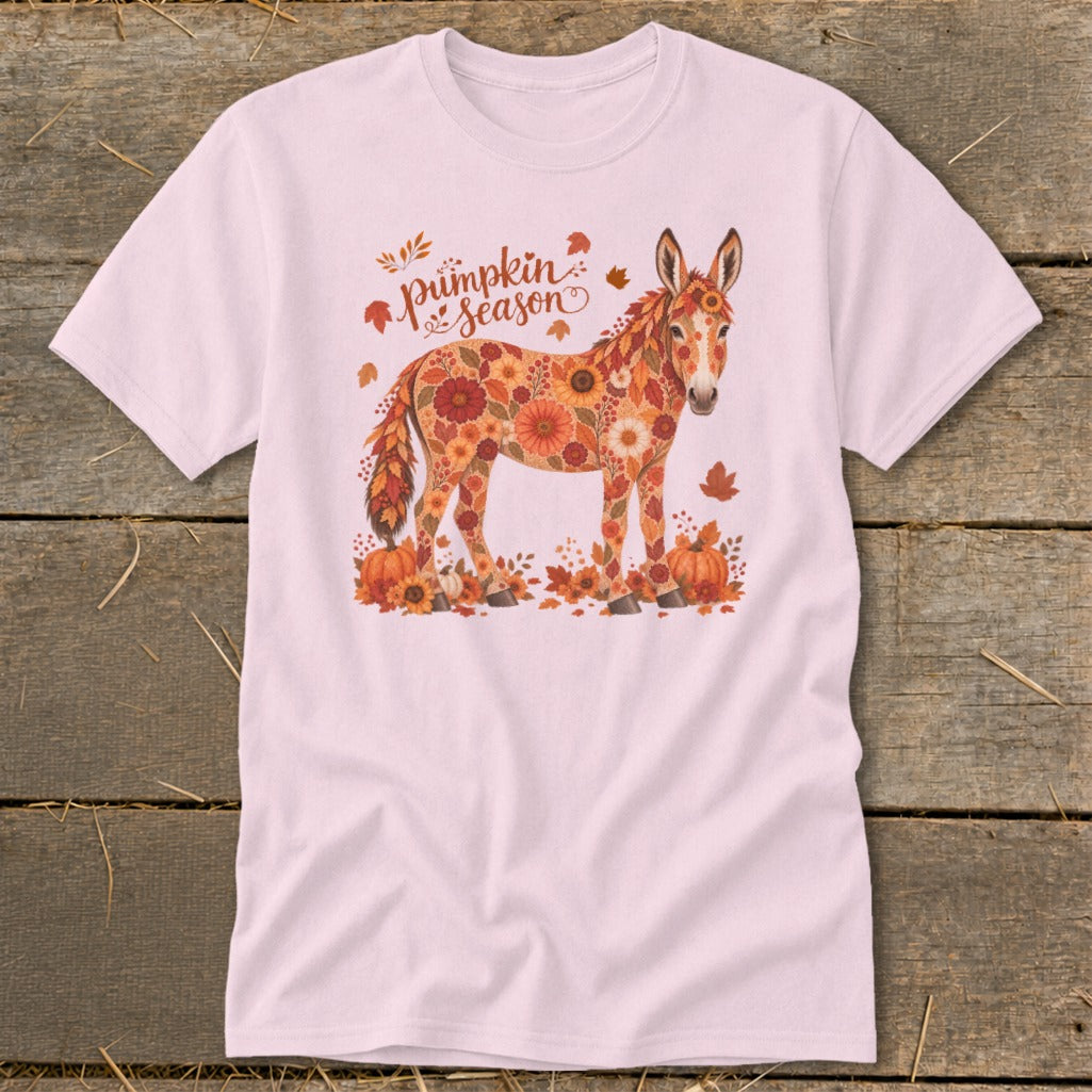 Pink t-shirt with a floral donkey surrounded by pumpkins and autumn leaves, and "pumpkin season" text.