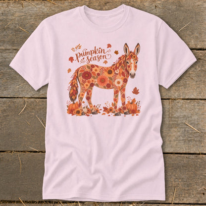Pink t-shirt with a floral donkey surrounded by pumpkins and autumn leaves, and "pumpkin season" text.