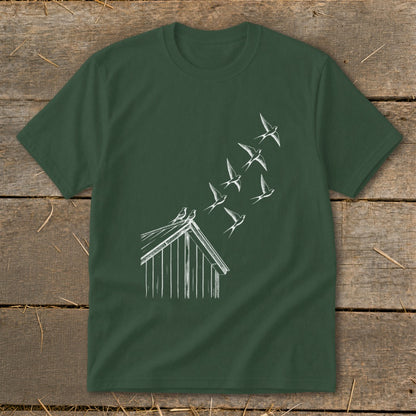 A forest green t-shirt features a white line drawing of birds flying from a roof.