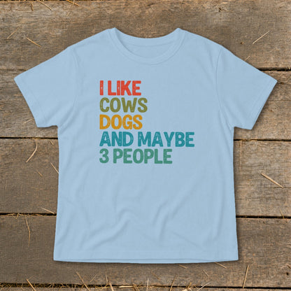 Light blue t-shirt with text "I LIKE COWS DOGS AND MAYBE 3 PEOPLE"