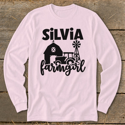 Pink long sleeve shirt with black text "SILVIA" and farm graphic.
