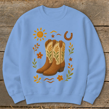 Light blue crewneck sweatshirt with cowboy boot and western-themed graphic.