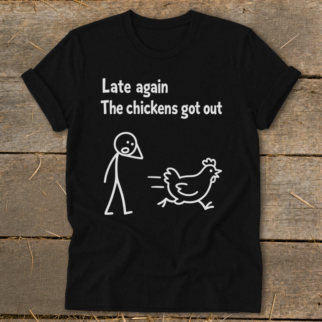 Black t-shirt with white text and stick figures: "Late again The chickens got out".