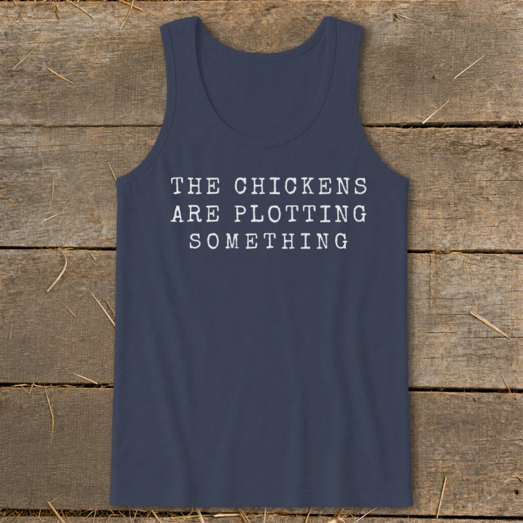 Navy tank top with white text reading "THE CHICKENS ARE PLOTTING SOMETHING".