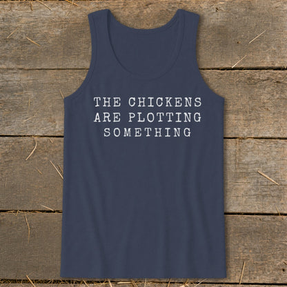 Navy tank top with white text reading "THE CHICKENS ARE PLOTTING SOMETHING".