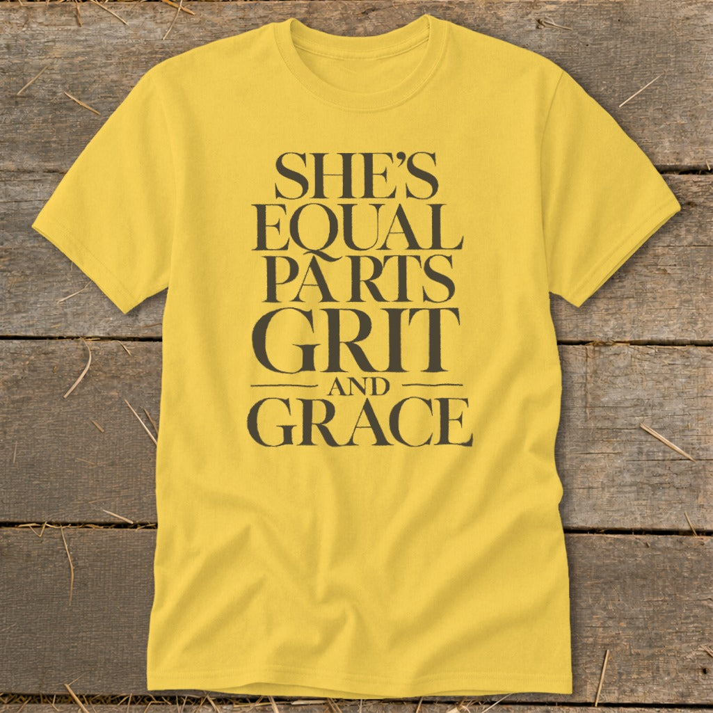 Yellow t-shirt with "SHE'S EQUAL PARTS GRIT AND GRACE" text.
