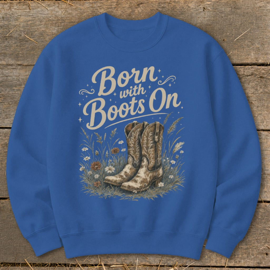 Blue sweatshirt with "Born with Boots On" text and cowboy boots illustration.