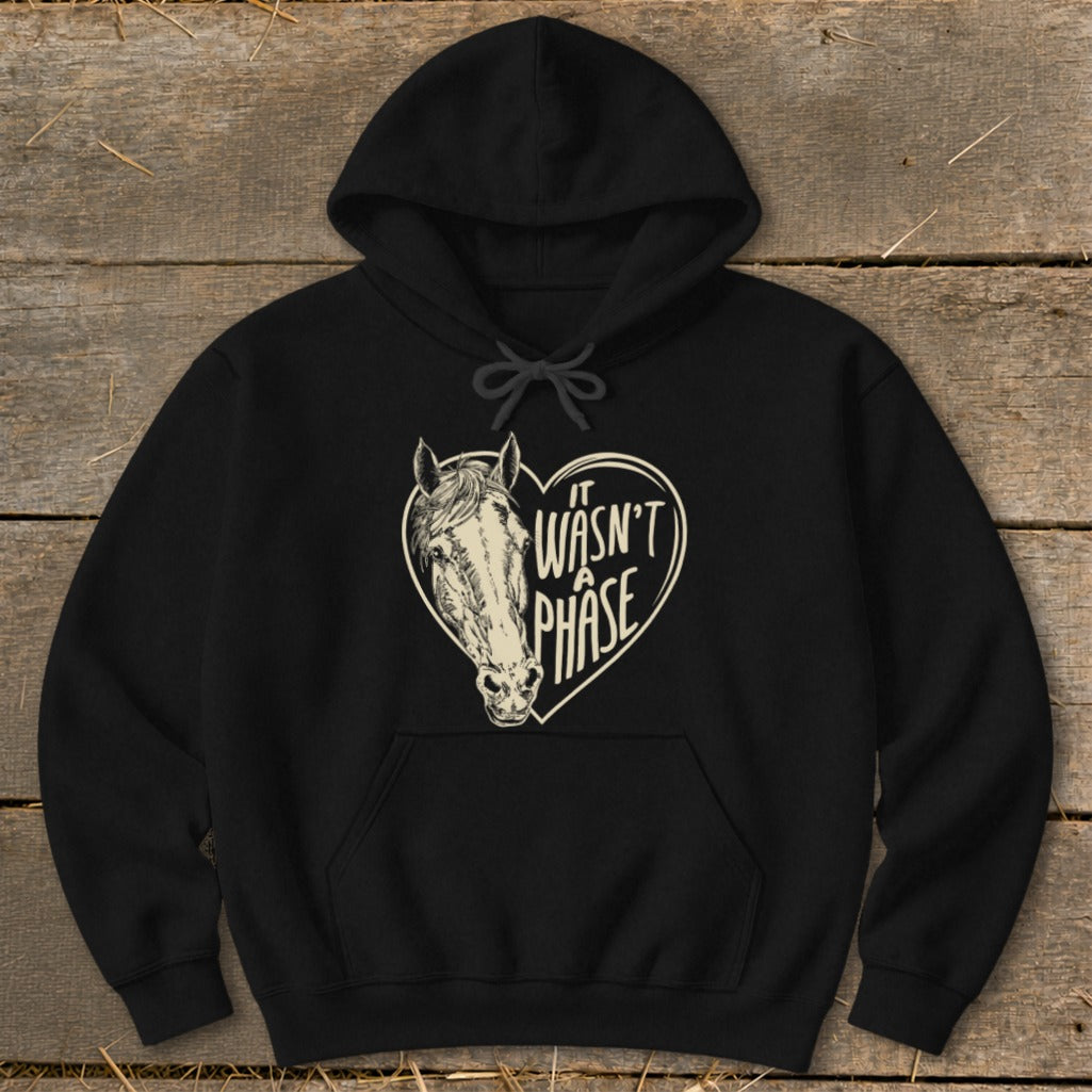Black hoodie with a horse head inside a heart graphic that reads "It Wasn't A Phase."