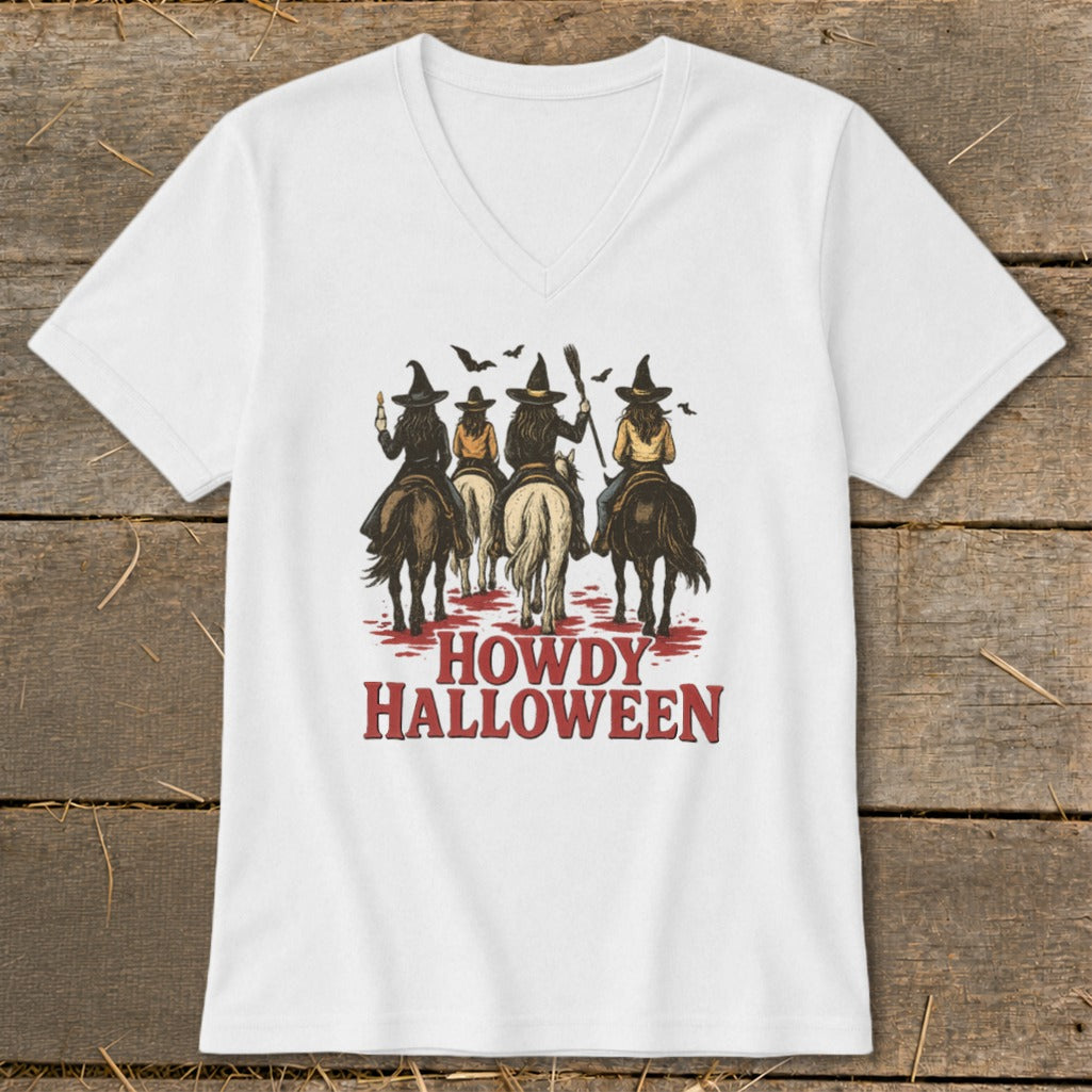 Witches on horses with broomsticks and candles with text "HOWDY HALLOWEEN".