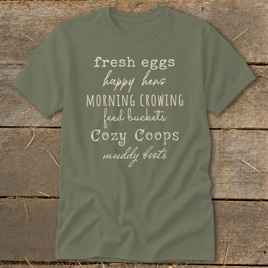 Olive green t-shirt with white text listing farm life phrases.