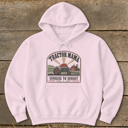 Pink hoodie with "Tractor Mama Sunrise to Sunset" graphic featuring a tractor and barn.
