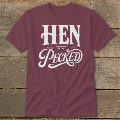 Maroon t-shirt with white text that reads "HEN PECKED".