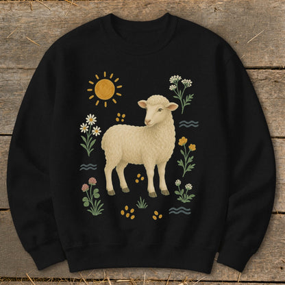 Black sweatshirt with a cream sheep surrounded by sun, flowers, and waves.