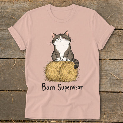Pink t-shirt with grumpy cat sitting on hay bale, text "Barn Supervisor".