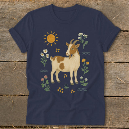 Navy t-shirt with a brown and white goat surrounded by flowers, sun, and waves.