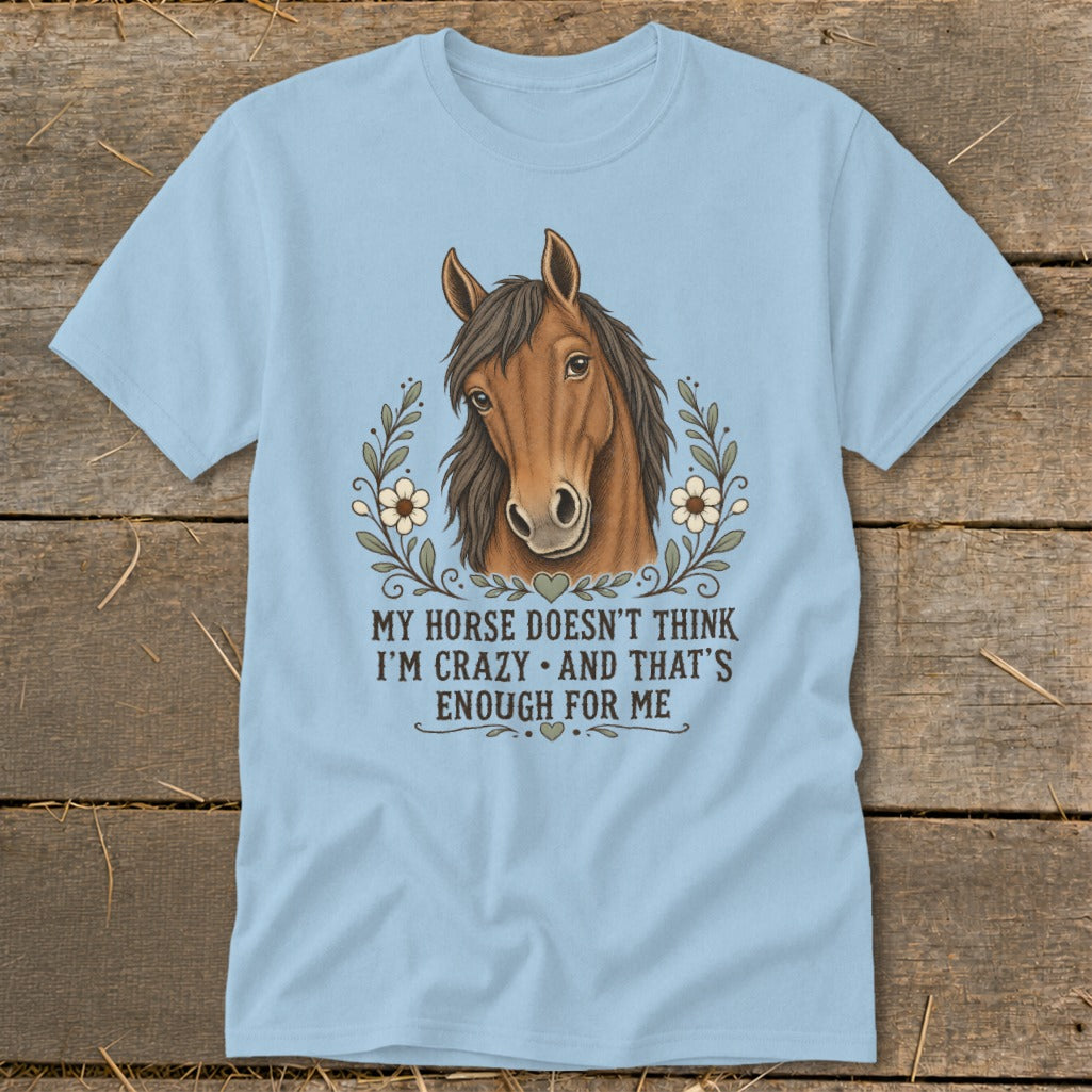 Light blue t-shirt with horse graphic and text.
