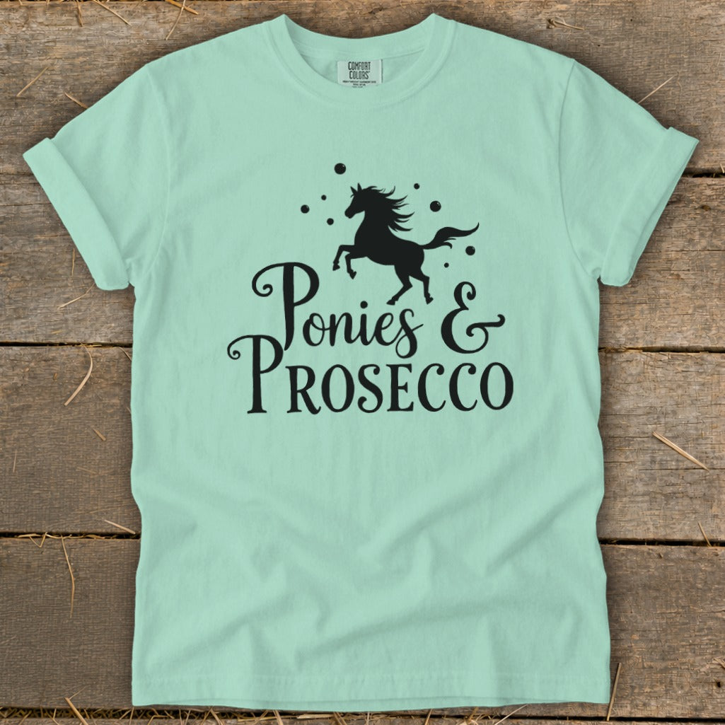 Mint green t-shirt with black graphic of a horse and "Ponies & Prosecco" text.