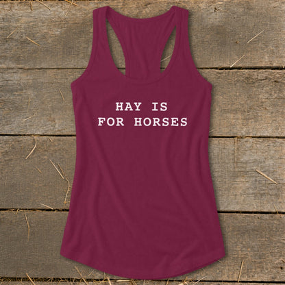 Maroon tank top with white text "HAY IS FOR HORSES".