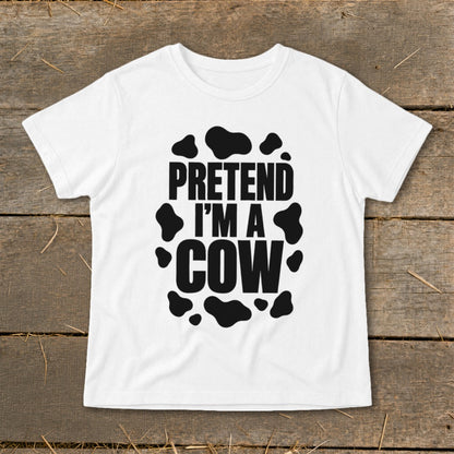 White t-shirt with black "Pretend I'm a Cow" text and cow spots.
