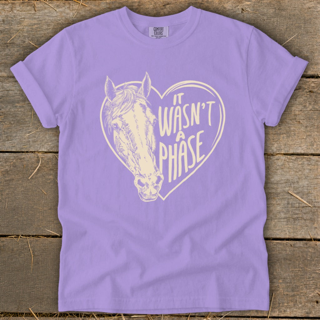 Lavender t-shirt with a heart graphic featuring a horse and text "It Wasn't A Phase".