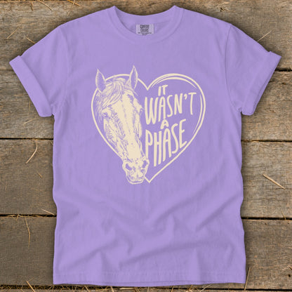 Lavender t-shirt with a heart graphic featuring a horse and text "It Wasn't A Phase".