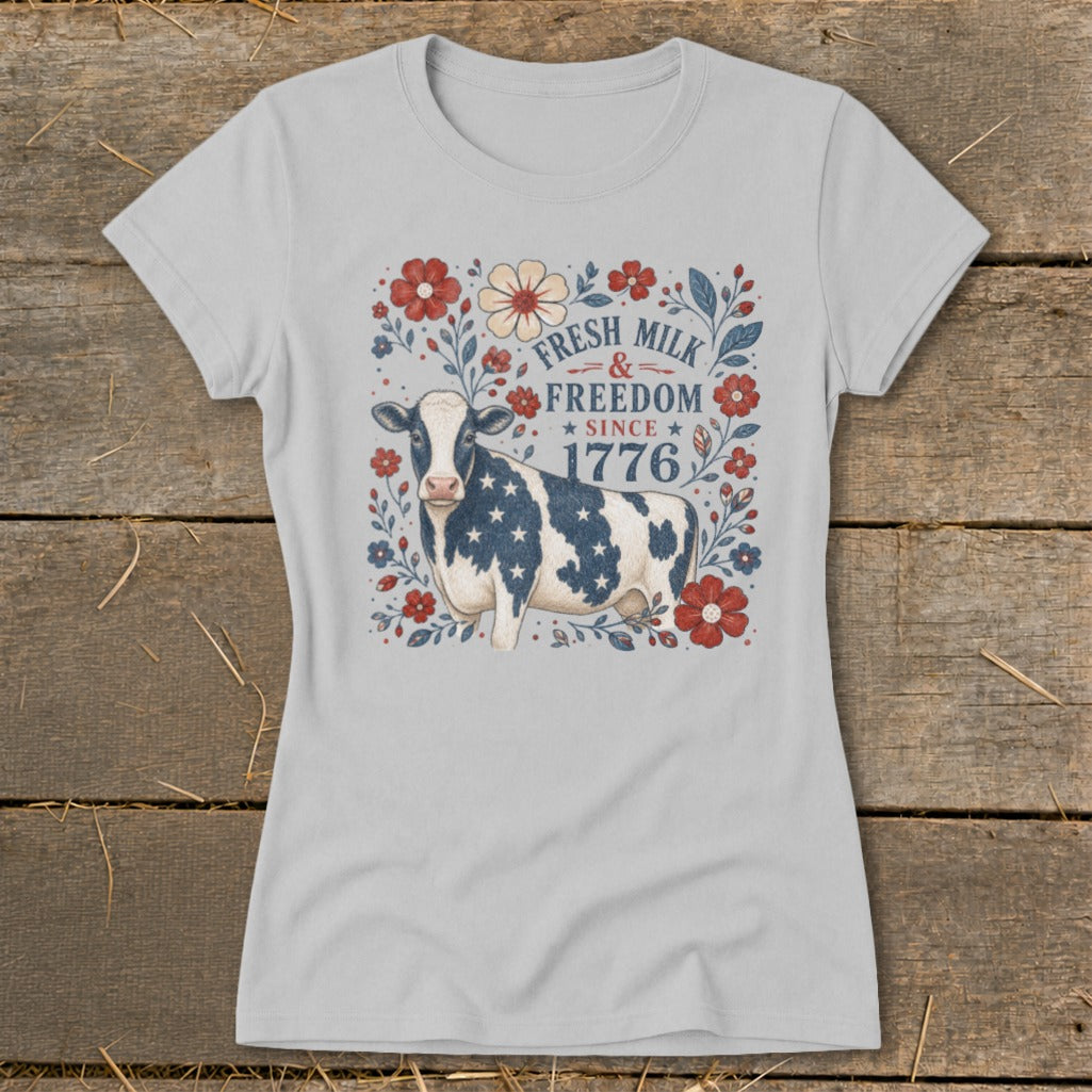 Gray t-shirt with a cow and floral design, reading "Fresh Milk & Freedom Since 1776."