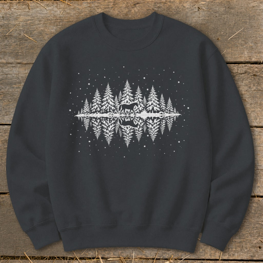 Dark gray sweatshirt with white graphic of a horse in a snowy forest reflected in water.