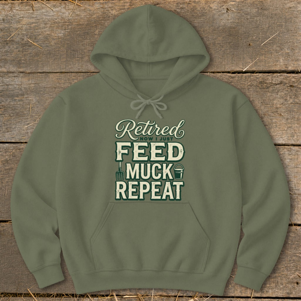 Olive green hoodie with "Retired Now I Just Feed Muck Repeat" graphic.