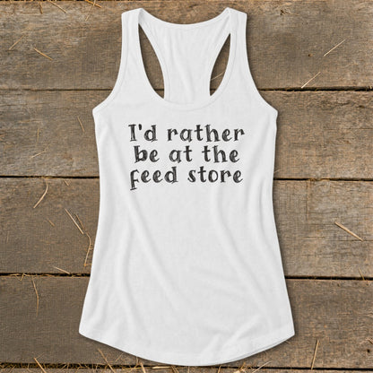 White tank top with "I'd rather be at the feed store" text.