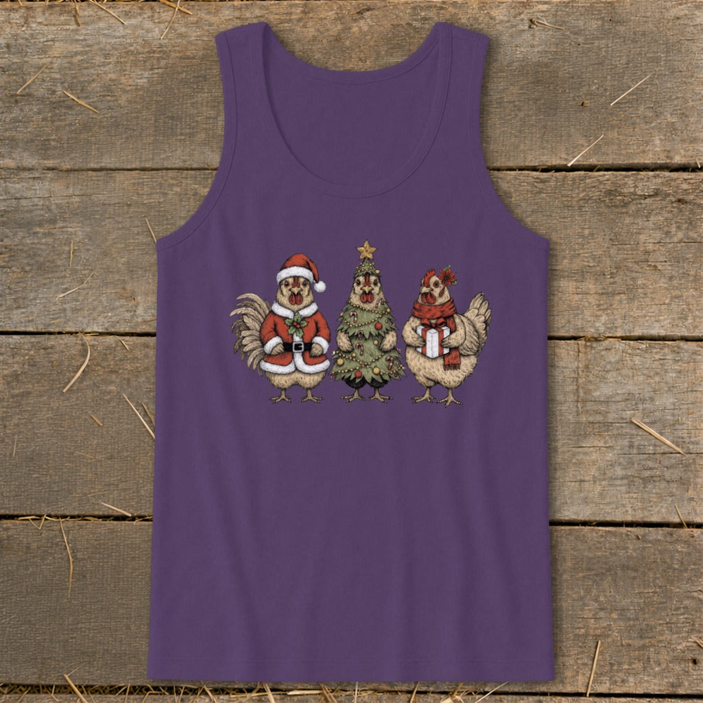 Three chickens in Christmas attire, including Santa suit, tree costume, and gift.