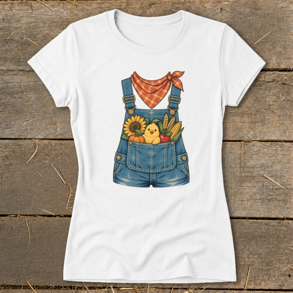 White t-shirt with a denim overall graphic containing a chick, sunflower, pumpkin, and corn.