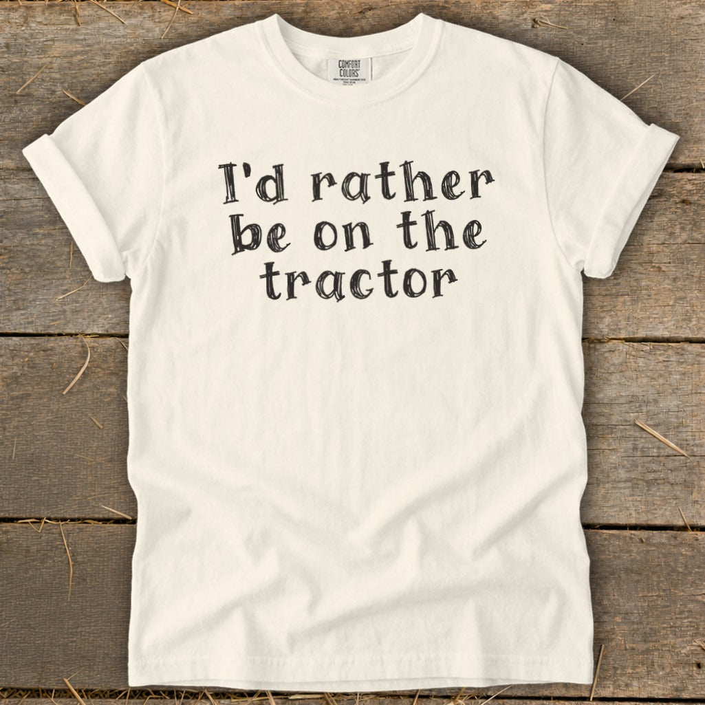 Cream t-shirt with black text "I'd rather be on the tractor."