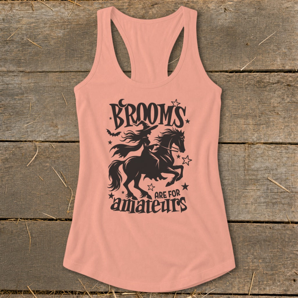 Peach tank top with black graphic text and witch riding a horse.