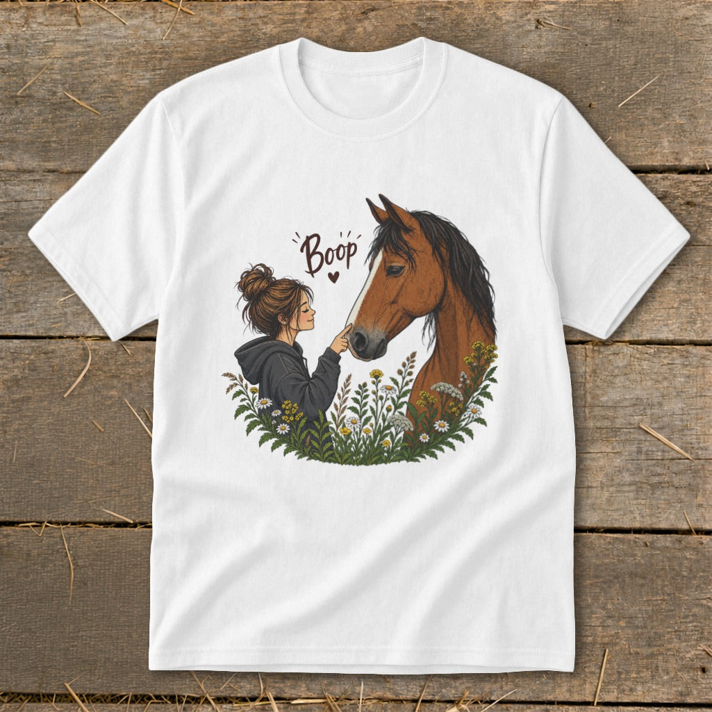 Girl gently touching horse's nose with finger, text "Boop" above.