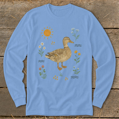 Light blue long-sleeve shirt with a brown duck, sun, and wildflowers graphic.