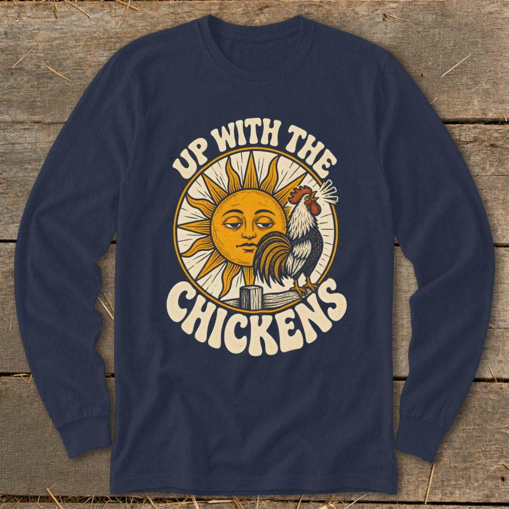 Navy long-sleeved t-shirt featuring a retro graphic of a crowing rooster and a smiling sun, with text reading Up With The Chickens.