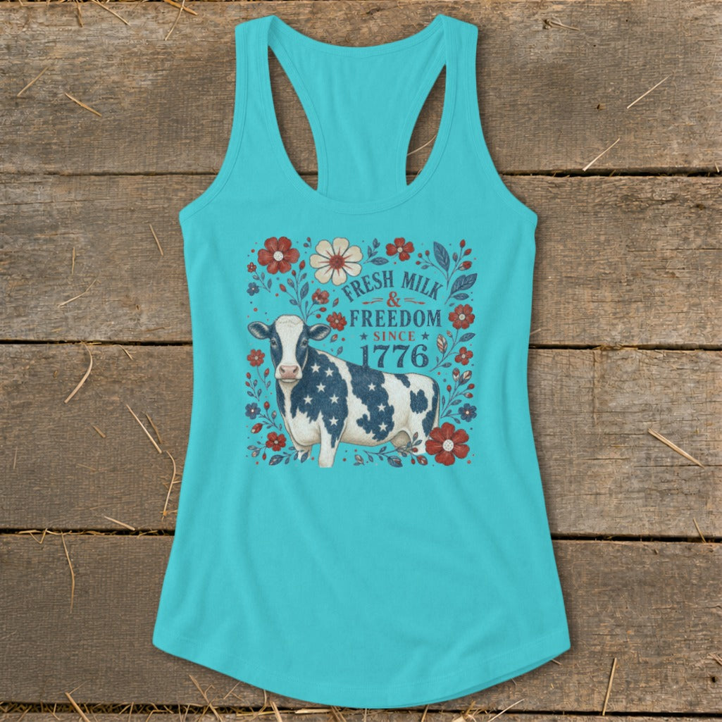 Turquoise tank top with patriotic cow graphic and floral border.