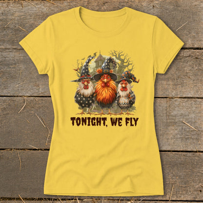 Yellow t-shirt with three chickens wearing witch hats and the text "TONIGHT, WE FLY".