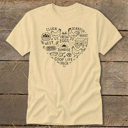 Cream t-shirt with heart-shaped chicken coop graphic and text: "Cluck, Nest, Sunrise, Coop Life, Peck, Scratch, Roost, Fresh Eggs."