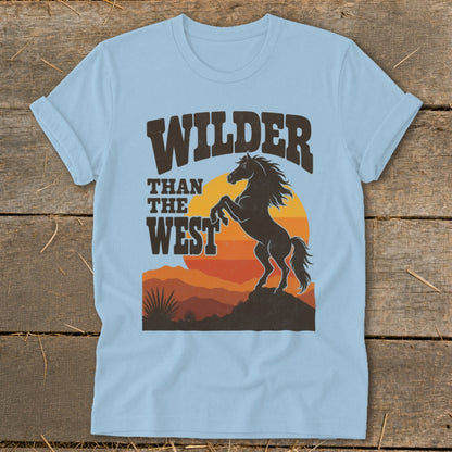 Light blue t-shirt with "WILDER THAN THE WEST" text and a rearing horse silhouette.