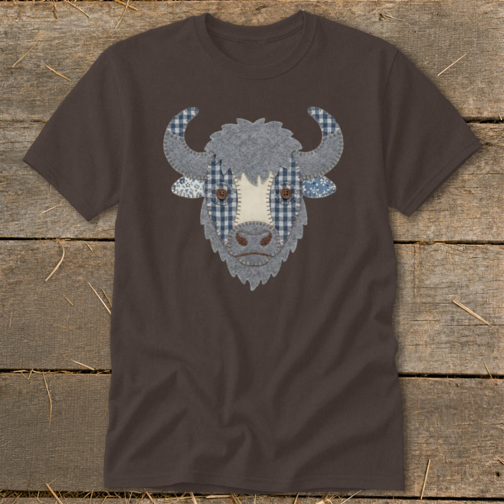 Brown t-shirt with a patchwork bull face graphic in gray, blue, and white fabrics.