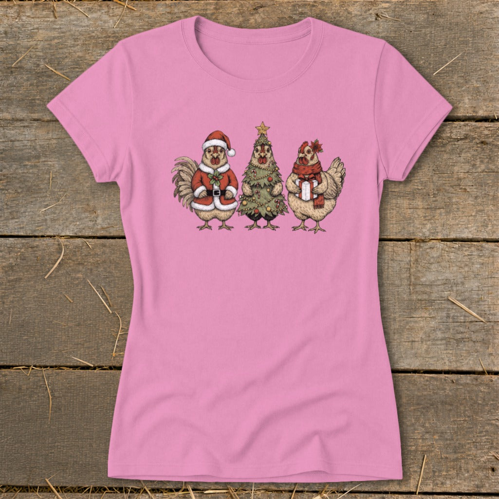 Pink t-shirt with a Christmas-themed illustration of three chickens.