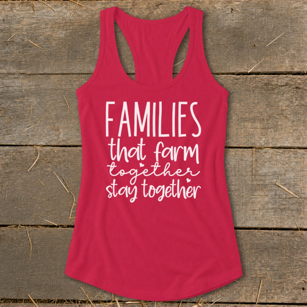 Pink racerback tank top with white text: "Families that farm together stay together."